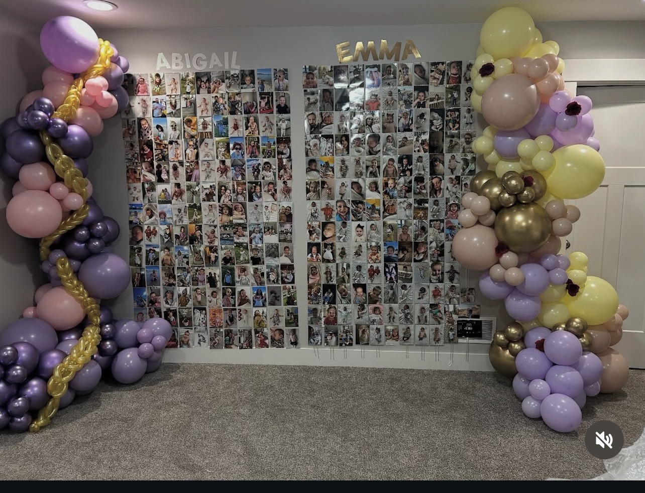 Purple and gold balloon garlands framing a milestone photo wall
